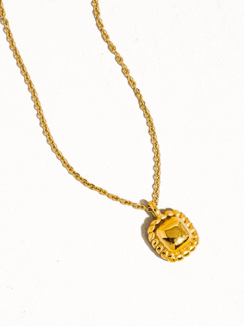 Classic petite square necklace on a white background. 